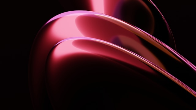Abstract flowing red and pink metallic curves create smooth, wave-like forms against a dark background.